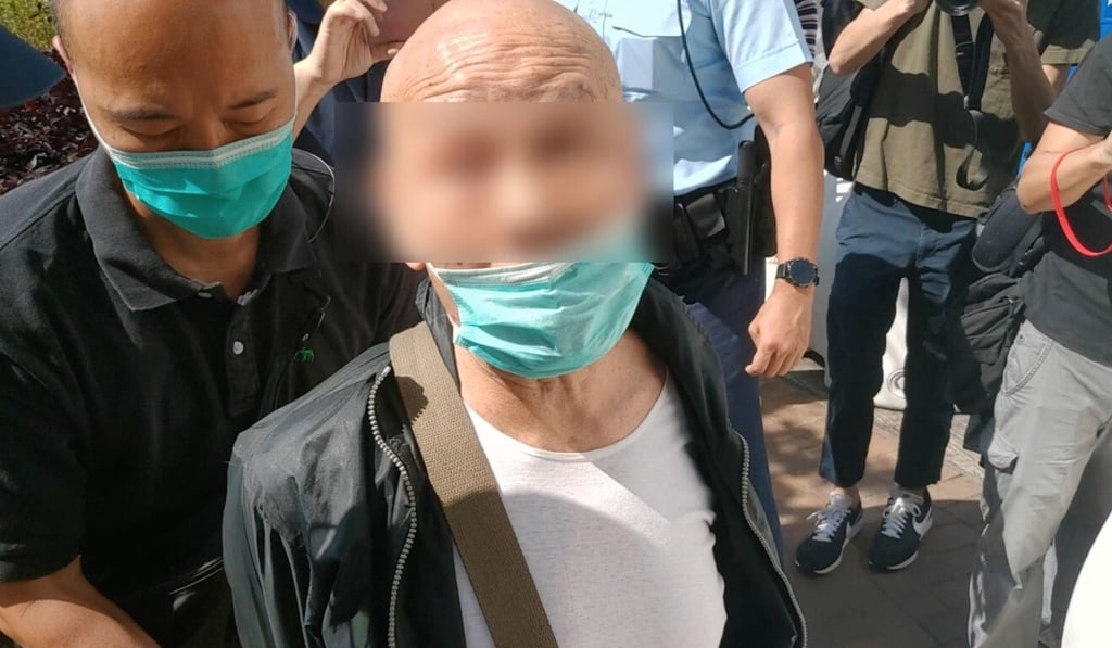 Police arrest an 81-year-old man who allegedly attacked former lawmaker Leung Kwok-hung outside Beijing’s liaison office with Hong Kong on Wednesday. Photo: SCMP