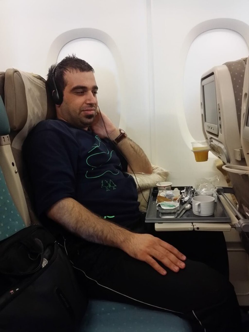 Alex Tyronne on the plane to Iraq in 2014, before his transformation. Photo: Handout