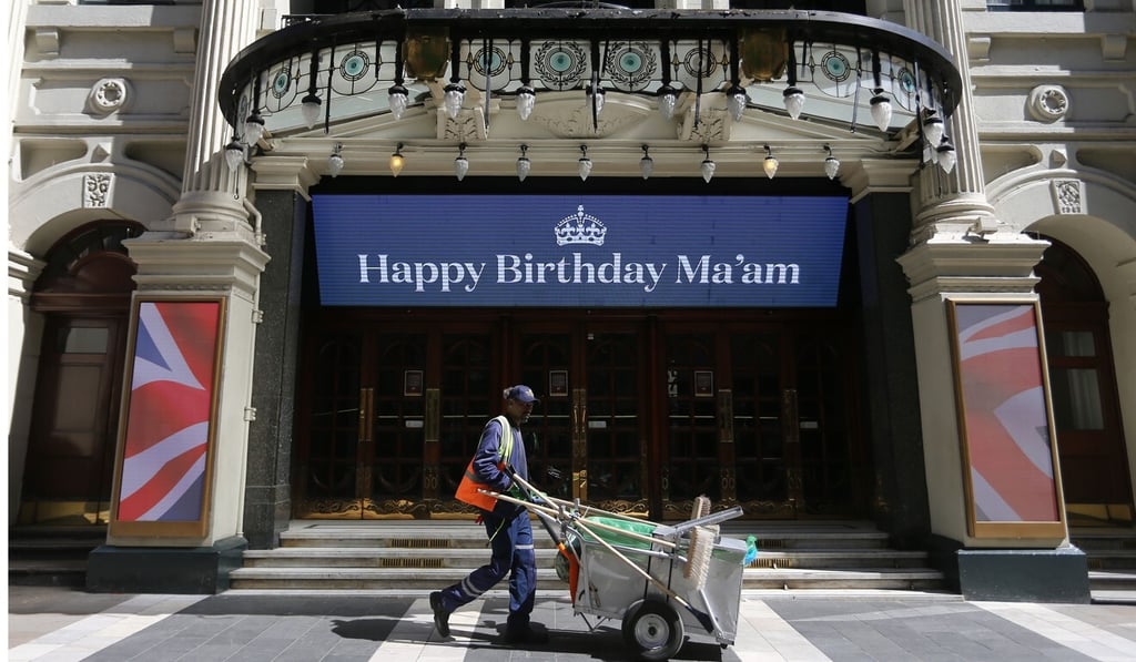 An electronic sign above the entrance to the London Palladium theatre relays a birthday wish for Queen Elizabeth. Photo: AFP An electronic sign above the entrance to the London Palladium theatre relays a birthday wish for Queen Elizabeth. Photo: AFP