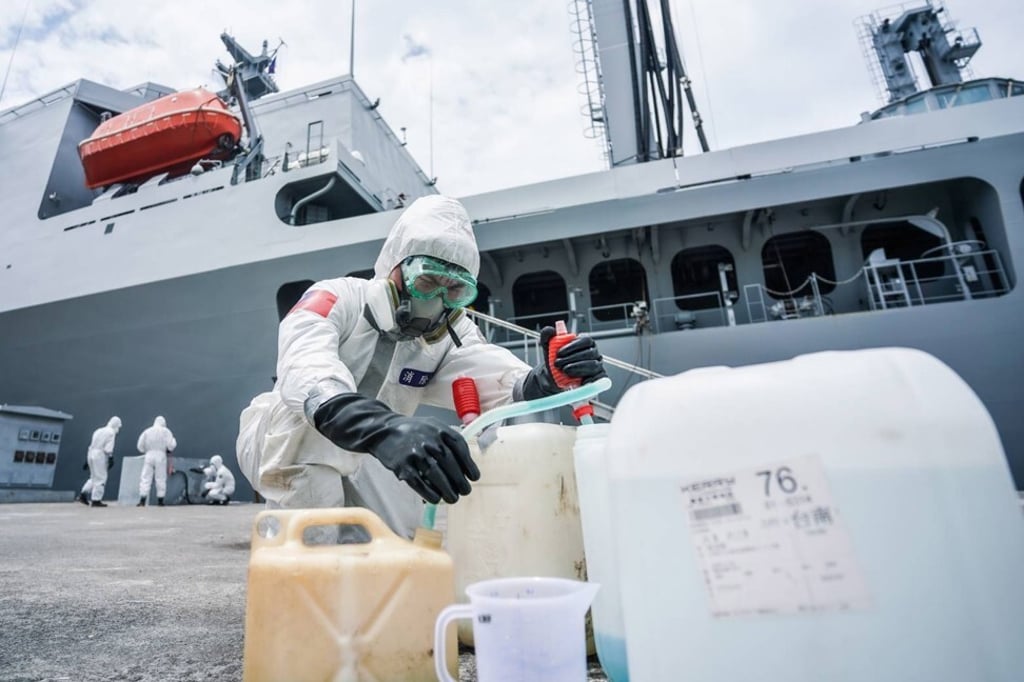 Soldiers from Taiwan’s military disinfect the Panshih supply ship at Zuoying Naval Base after navy personnel tested positive for coronavirus. Photo: Handout Soldiers from Taiwan’s military disinfect the Panshih supply ship at Zuoying Naval Base after navy personnel tested positive for coronavirus. Photo: Handout