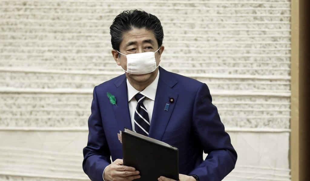Japan Prime Minister Shinzo Abe wears a protective face mask after a news conference in Tokyo on April 17. Photo: Bloomberg