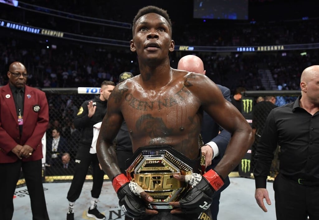 Israel Adesanya celebrates after defeating Yoel Romero to retain the middleweight title at UFC 248. Photo: Jeff Bottari/Zuffa LLC