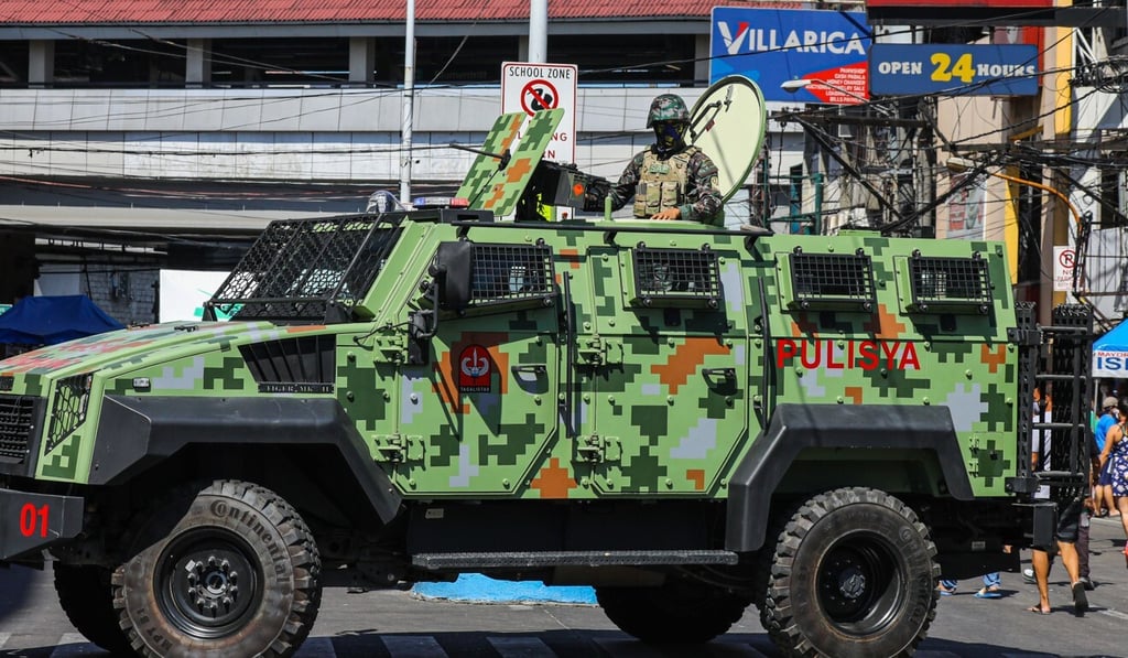 Officers on patrol during lockdown in Manila. Photo: AFP