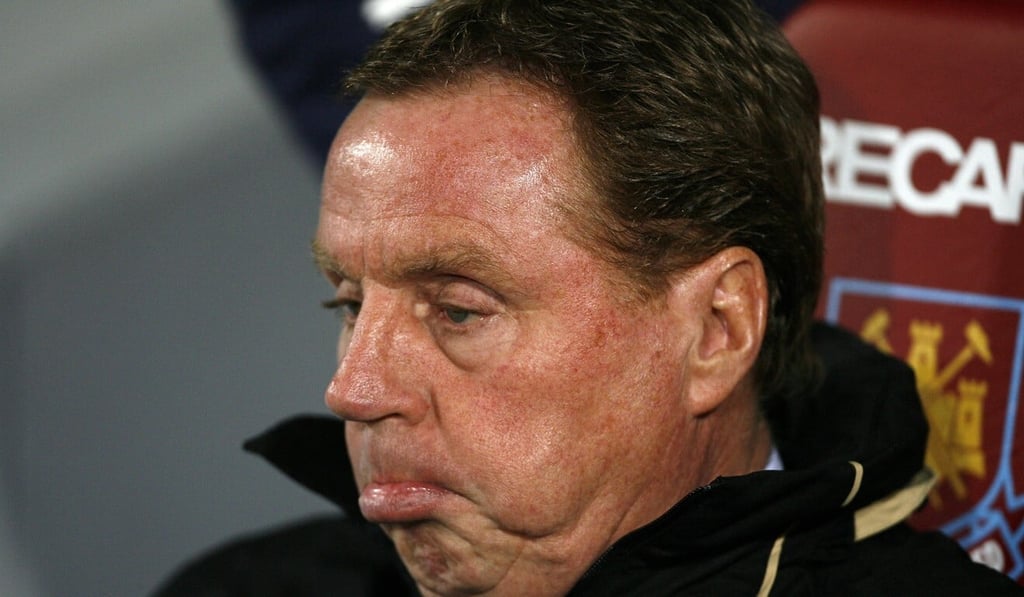 Tottenham Hotspur manager Harry Redknapp sits prior to their Premier League match against West Ham at Upton Park in 2008. Photo: AFP