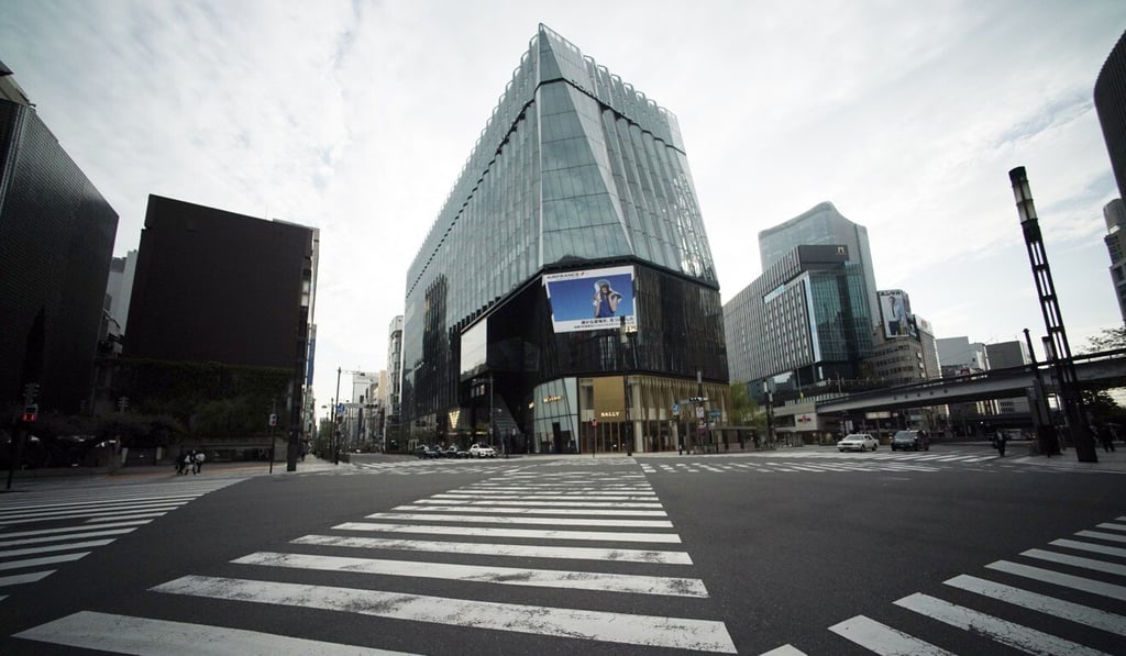 An empty shopping district is seen in Tokyo on Tuesday. Japanese have been urged to stay home to curb the spread of coronavirus. Photo: AP