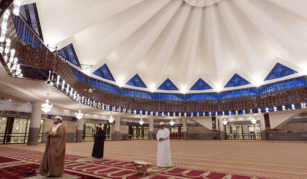 An imam leads a prayer during the first day of Ramadan at the National Mosque of Malaysia in Kuala Lumpur. Under the partial lockdown, religious gatherings are banned. Photo: AP
