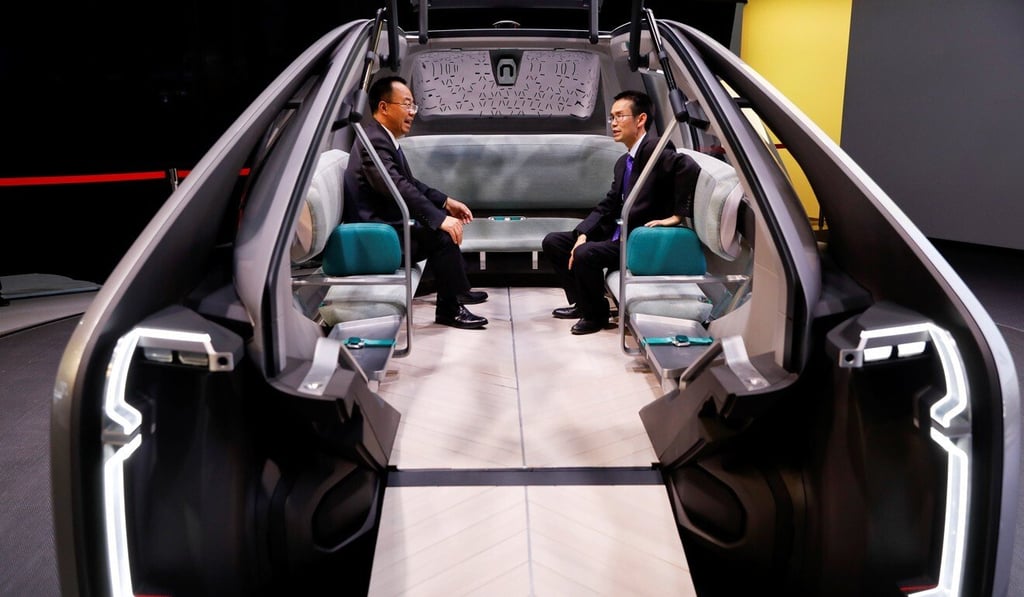 People sit inside Renault’s EZ-GO at the Auto China 2018 motor show in Beijing on April 25, 2018. Renault transferred full ownership of its Wuhan plant to Donfeng Motor Corp this month. Photo: Reuters