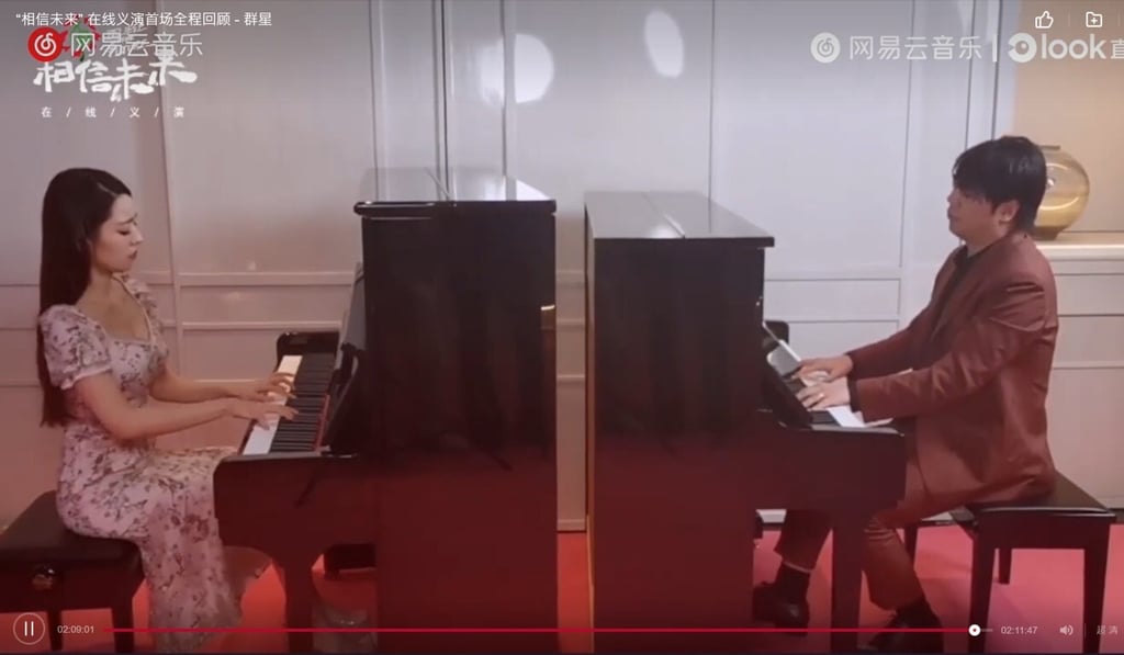 Lang Lang and his wife, Gina Alice Redlinger, perform Ode to the Yellow River on two pianos to close out the first of three “Believe in the Future” concert tributes to coronavirus fighters. Photo: Believe in the Future