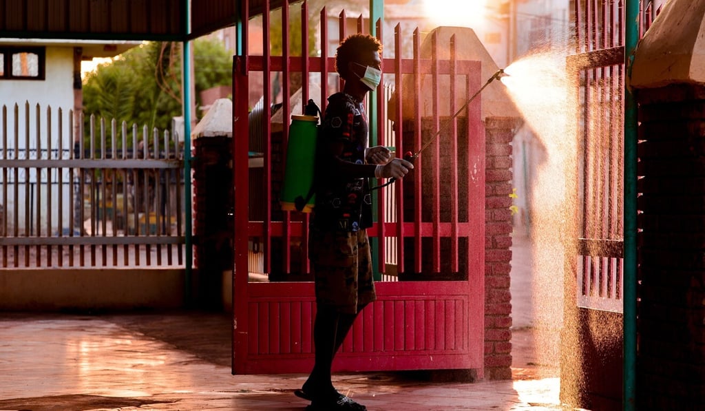 A worker sprays disinfectant at a mosque in Khartoum, Sudan, amid fears of the spread of the coronavirus. Photo: DPA A worker sprays disinfectant at a mosque in Khartoum, Sudan, amid fears of the spread of the coronavirus. Photo: DPA
