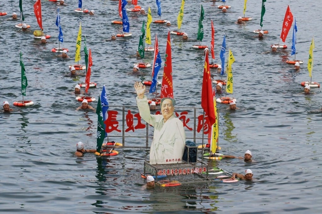 Swimmers with a portrait of Mao Zedong, to celebrate the anniversary of the late Chinese leader’s 1966 swim in the Yangtze River, in Wuhan. Photo: Reuters
