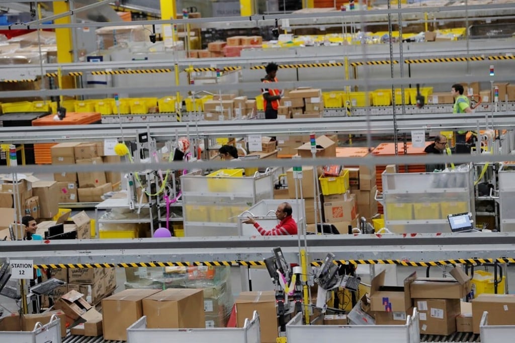 Amazon.com workers are seen inside a fulfilment centre in New Jersey in December of last year. The company expects to spend US$4 billion or more on Covid-19-related expenses for getting products to customers and keeping employees safe. Photo: Reuters