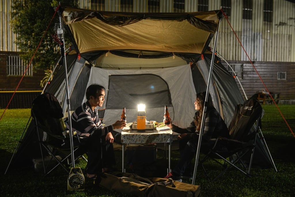 A couple in a tent at Rainbow Garden Campground. Photo: Chris Stowers/PANOS