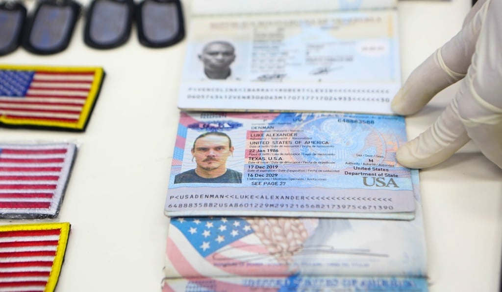 The passports of US citizens arrested by security forces are displayed at the Miraflores Presidential Palace in Caracas on Monday. Photo: Venezuelan presidency via AFP