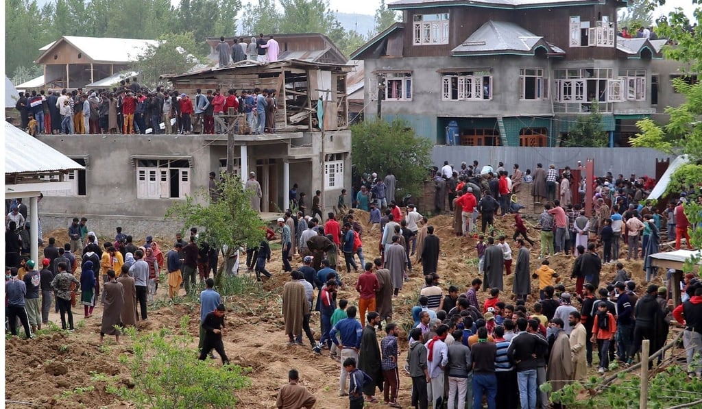 People gather after two militants were killed in a gun battle with Indian soldiers at Beighpora village in south Kashmir's Pulwama district. Photo: Reuters People gather after two militants were killed in a gun battle with Indian soldiers at Beighpora village in south Kashmir's Pulwama district. Photo: Reuters