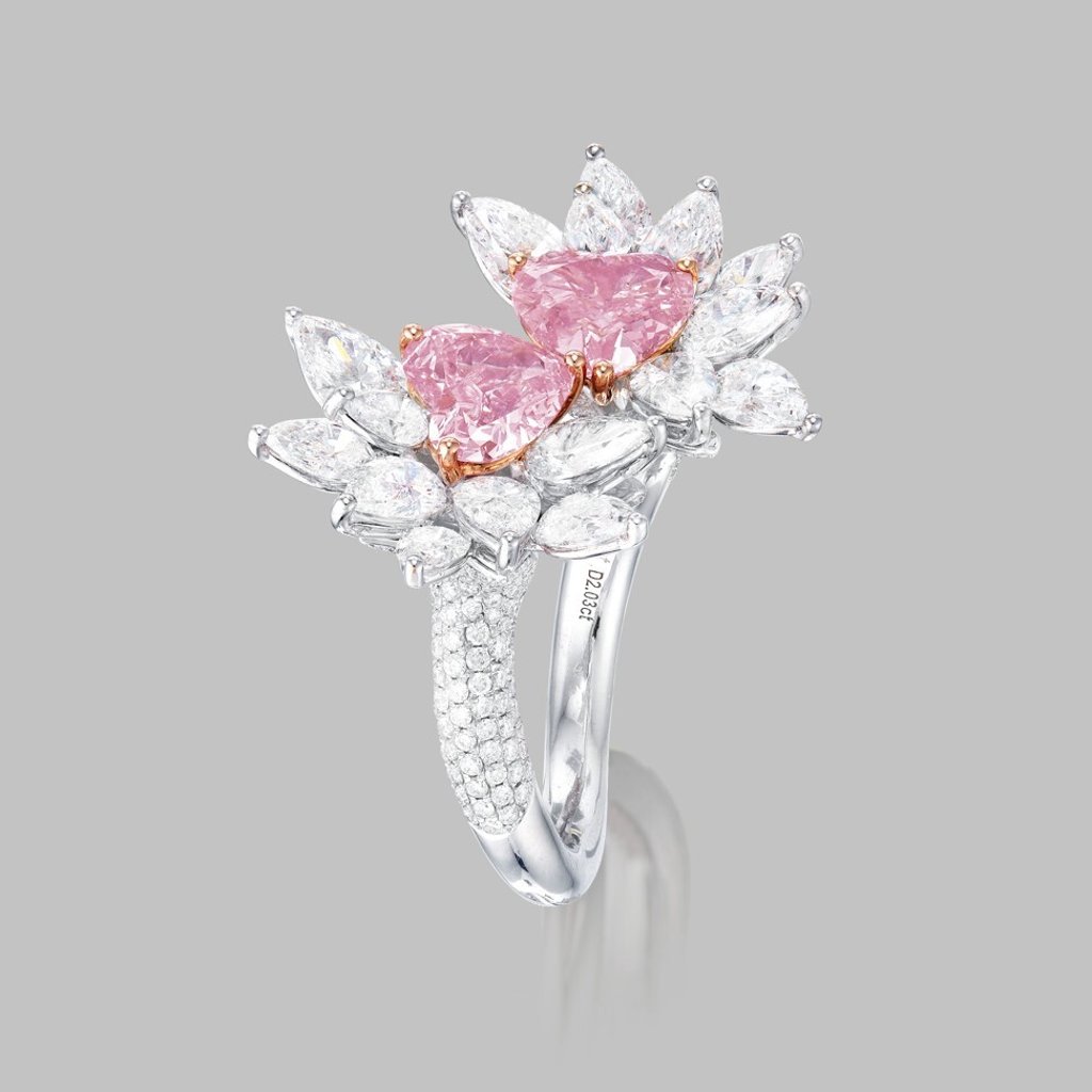 Fancy vivid purplish pink diamond, fancy intense purplish pink diamond and white diamond ring that can be turned into earrings.