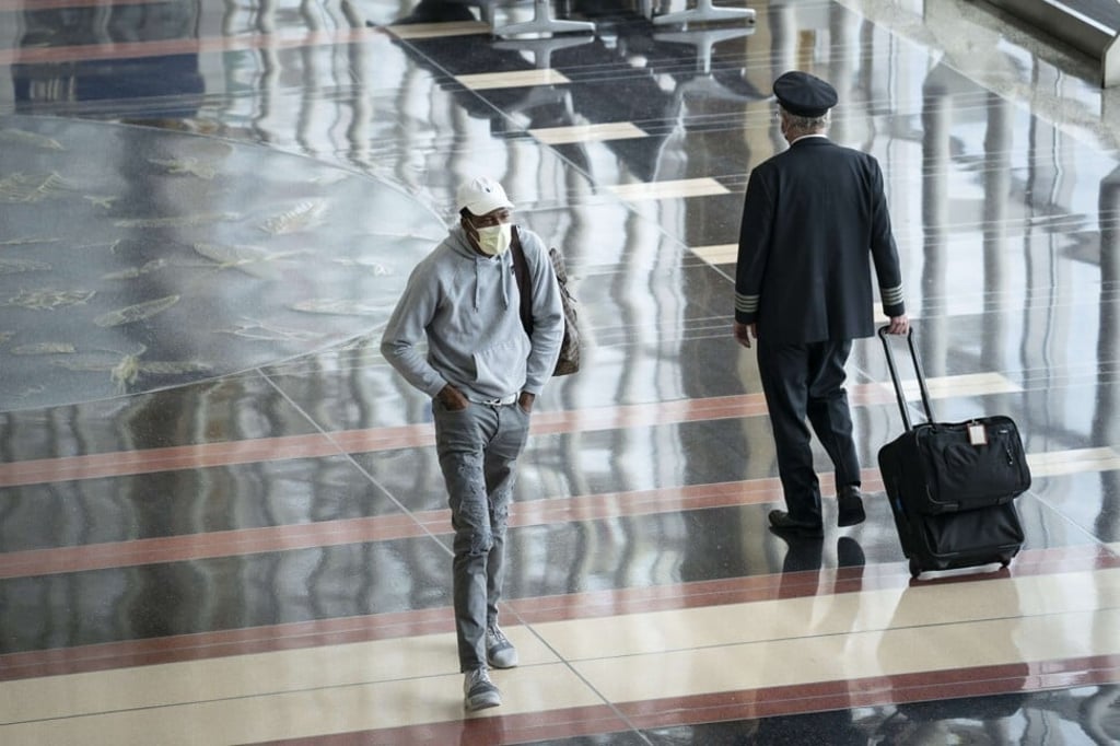 A traveller walks through a mostly empty terminal at Ronald Reagan Washington National Airport. Photo: Getty Images