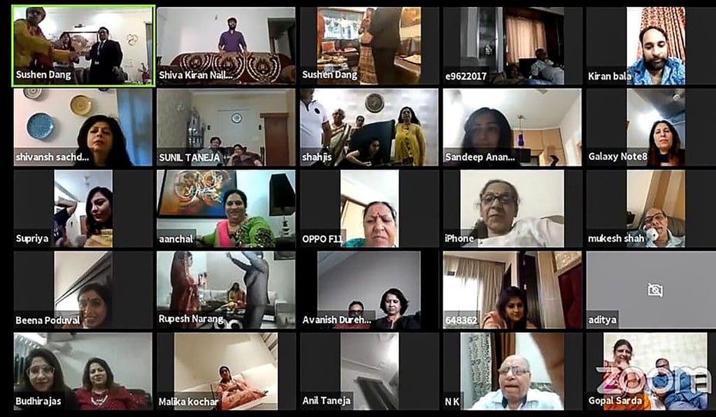This handout screenshot of a video call on April 19, 2020 received courtesy of Shaadi.com shows relatives and friends watching a livestream of wedding celebrations of groom Sushen Dang (L in top L) at his home in Mumbai and bride Keerti Narang (not pictured). Photo: AFP / Courtesy of Shaadi.com This handout screenshot of a video call on April 19, 2020 received courtesy of Shaadi.com shows relatives and friends watching a livestream of wedding celebrations of groom Sushen Dang (L in top L) at his home in Mumbai and bride Keerti Narang (not pictured). Photo: AFP / Courtesy of Shaadi.com