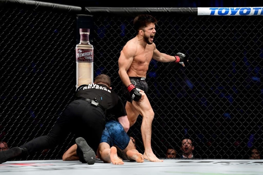 Henry Cejudo celebrates after defending his flyweight title against TJ Dillashaw via 32-second TKO. Photo: AFP