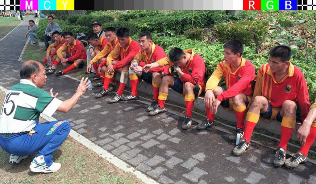 The Chinese People’s Liberation Army players receive some coaching advice during the HKFC Tens. Photo: AFP