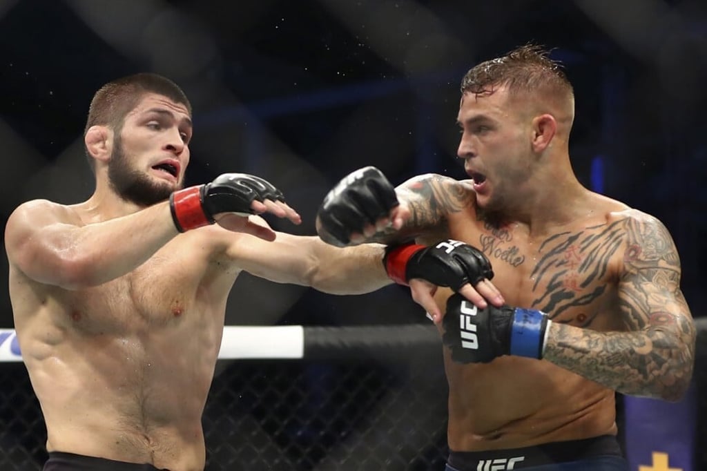Dustin Poirier throws a punch at Khabib Nurmagomedov. Photo: AP
