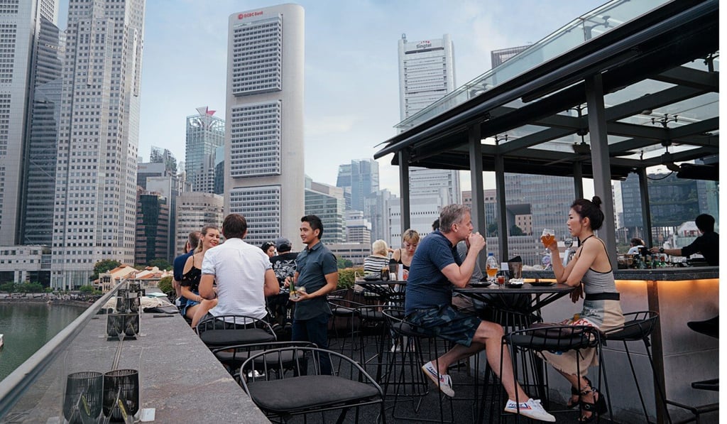 People socialise at a bar in Boat Quay before the coronavirus circuit breaker measures were implemented. Photo: Handout