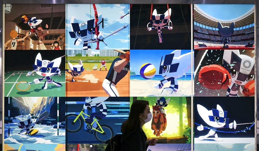 Posters on a street in Tokyo keep the rescheduled Olympics in citizens’ consciousness. Photo: Kyodo