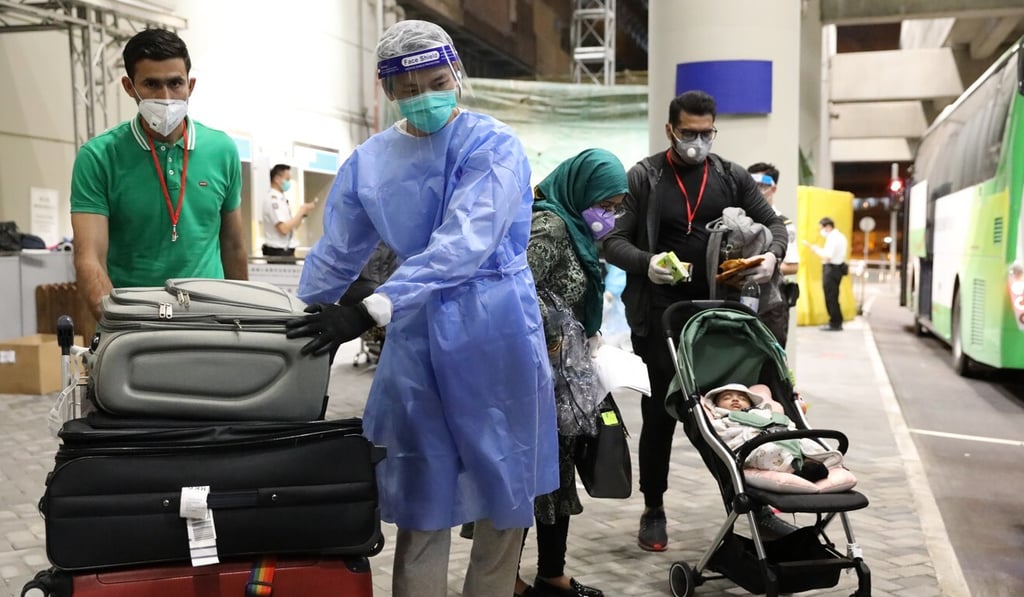 Hong Kong residents arrive from Pakistan at Hong Kong International Airport on Thursday. Photo: K.Y. Cheng