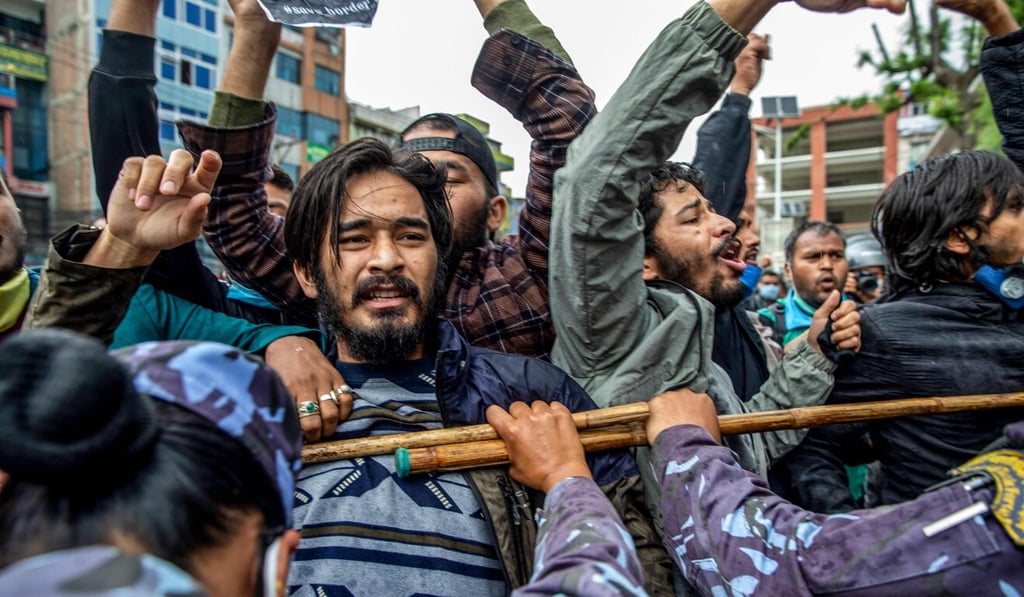 Police in Kathmandu on May 10, 2020 detain demonstrators during a protest against India’s new link road to the Chinese border. Photo: AFP Police in Kathmandu on May 10, 2020 detain demonstrators during a protest against India’s new link road to the Chinese border. Photo: AFP