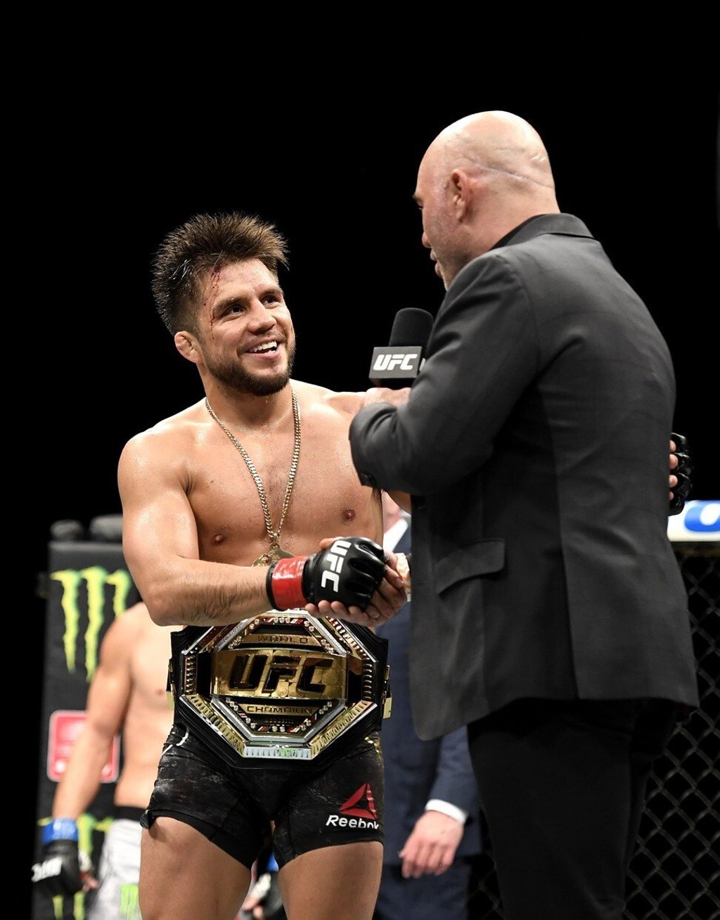 Announcer Joe Rogan congratulates Henry Cejudo. Photo: AFP Announcer Joe Rogan congratulates Henry Cejudo. Photo: AFP