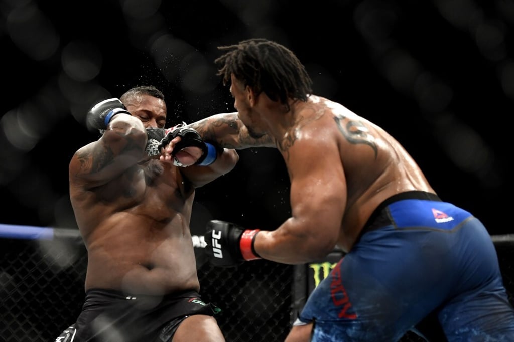 Greg Hardy swings at Yorgan De Castro. Photo: AFP