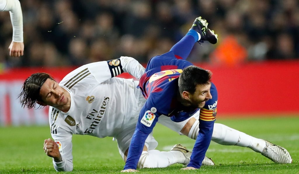 Barcelona's forward Lionel Messi (R) in action against Real Madrid's defender Sergio Ramos (L) in December, 2019. Photo: EPA