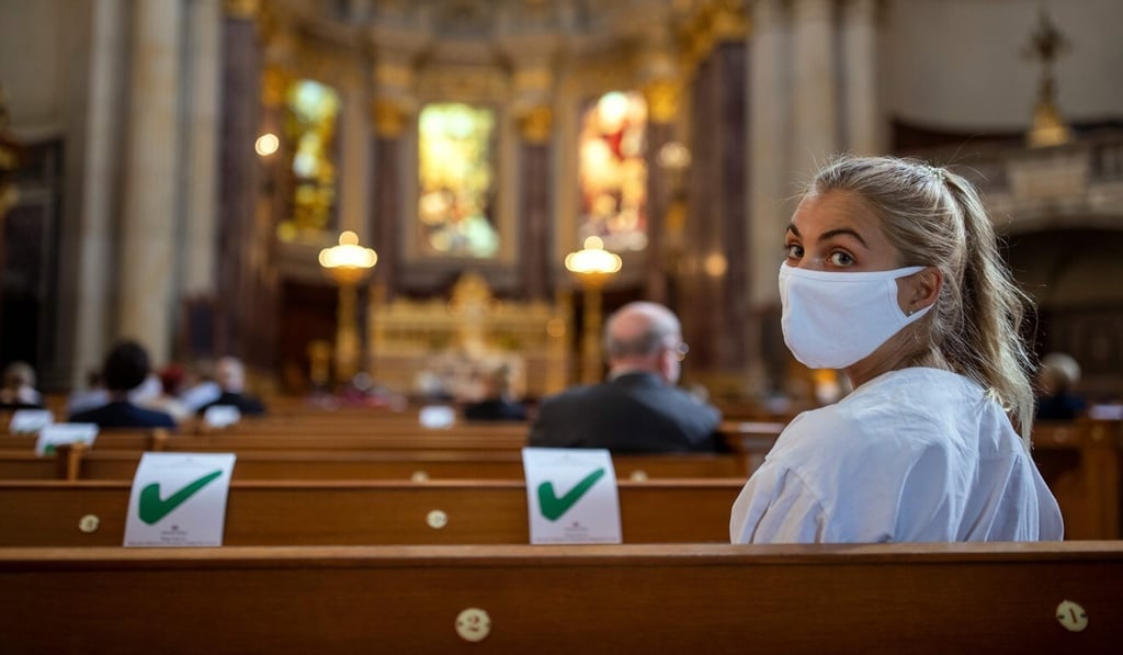 A woman wearing a protective face mask attends a Sunday service at the Berliner Dom cathedral in Berlin on Sunday. Photo: AFP A woman wearing a protective face mask attends a Sunday service at the Berliner Dom cathedral in Berlin on Sunday. Photo: AFP