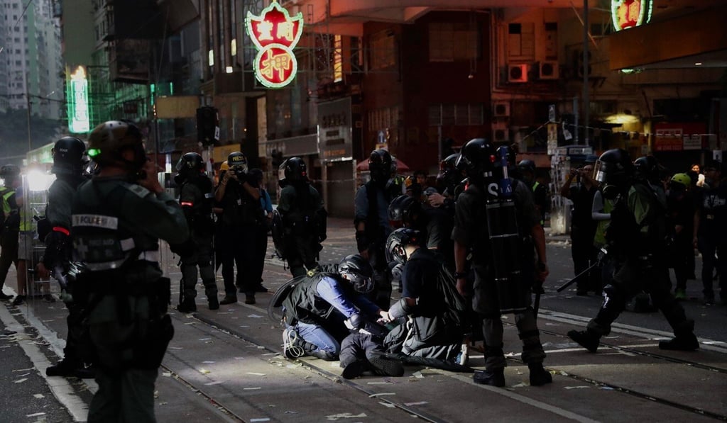 An anti-government protester is detained by Special Tactical Squad officers in Wan Chai in October. Photo: Winson Wong