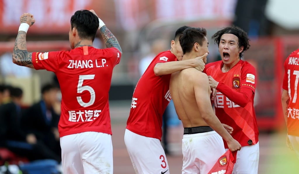 Guangzhou Evergrande players celebrate another CSL championship title after beating Shanghai Shenhua in their last match of the 2019 season. Photo: Xinhua