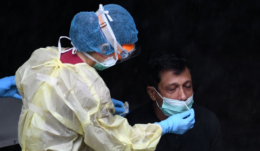 In Singapore, Covid-19 patients must twice test negative for the disease to be considered ‘recovered’. Photo: AFP In Singapore, Covid-19 patients must twice test negative for the disease to be considered ‘recovered’. Photo: AFP