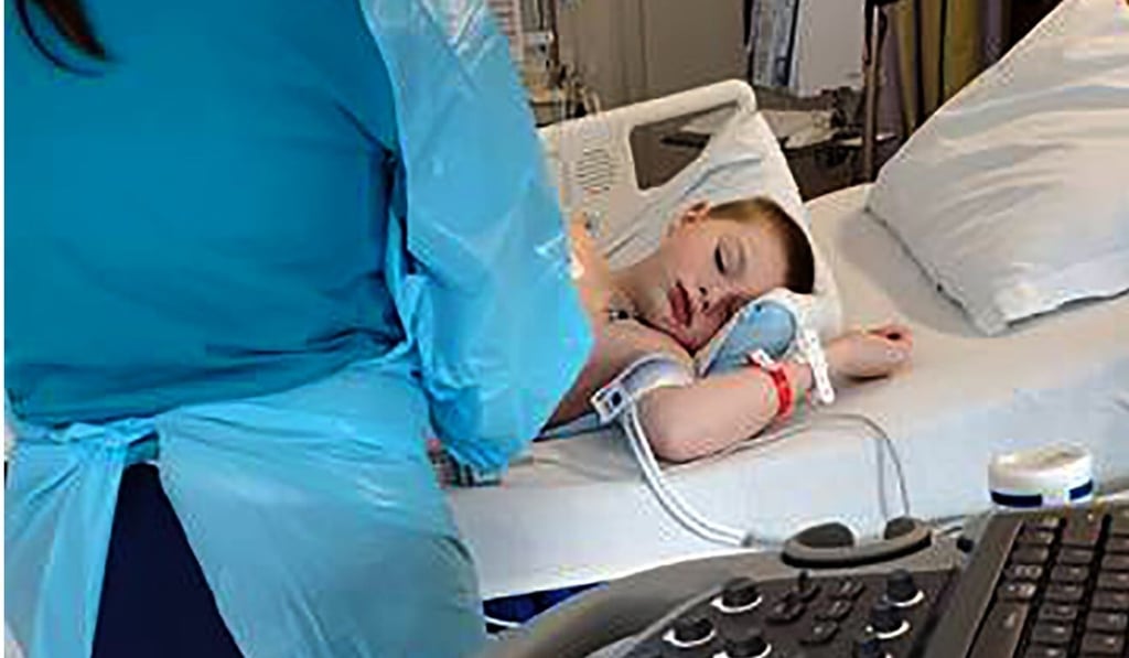 A nine-year-old boy is treated in a New York hospital after being admitted with severe dehydration, abdominal pain and a racing heart. He tested positive for coronavirus. Photo: AP A nine-year-old boy is treated in a New York hospital after being admitted with severe dehydration, abdominal pain and a racing heart. He tested positive for coronavirus. Photo: AP