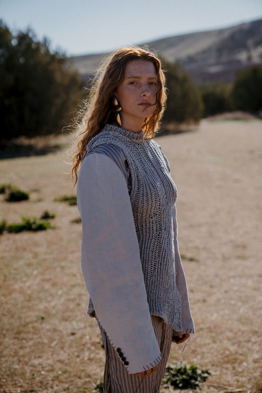 Acne Studios dress, HK$9,000 (US$1,161), knitted vest, HK$4,700; Monies earrings, price on request Acne Studios dress, HK$9,000 (US$1,161), knitted vest, HK$4,700; Monies earrings, price on request