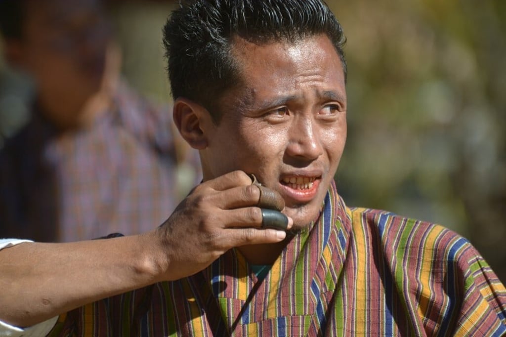 An archer watching his arrow fly in Bhutan. Photo: Chris Dwyer