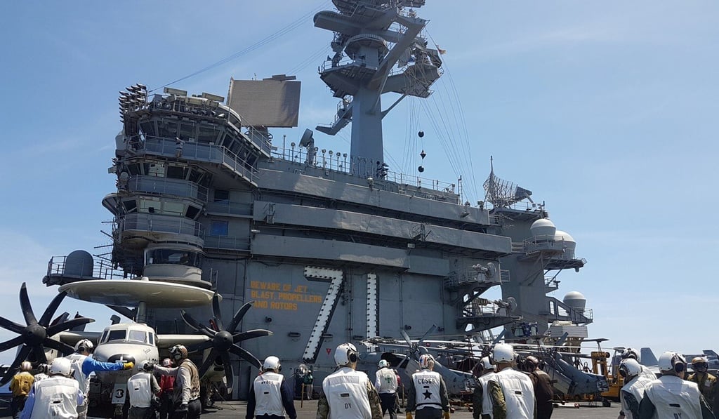 A busy day on the flight deck of the USS Theodore Roosevelt while transiting the South China Sea on April 10, 2018. The aircraft carrier strike group has been sidelined due to a Covid-19 outbreak among the crew. Photo: Reuters