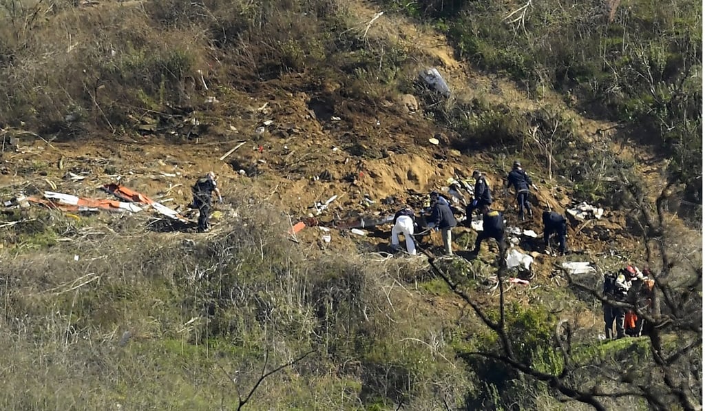 Investigators work the scene of a helicopter crash that killed former NBA basketball player Kobe Bryant and eight others in January. Photo: AP Investigators work the scene of a helicopter crash that killed former NBA basketball player Kobe Bryant and eight others in January. Photo: AP
