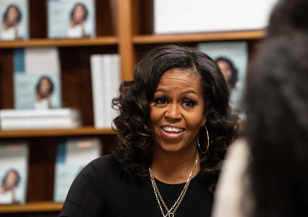 Former US First Lady Michelle Obama meets fans during a book signing on the first anniversary of the launch of her memoir Becoming at a Washington DC bookstore in November 2019. Photo: AFP Former US First Lady Michelle Obama meets fans during a book signing on the first anniversary of the launch of her memoir Becoming at a Washington DC bookstore in November 2019. Photo: AFP