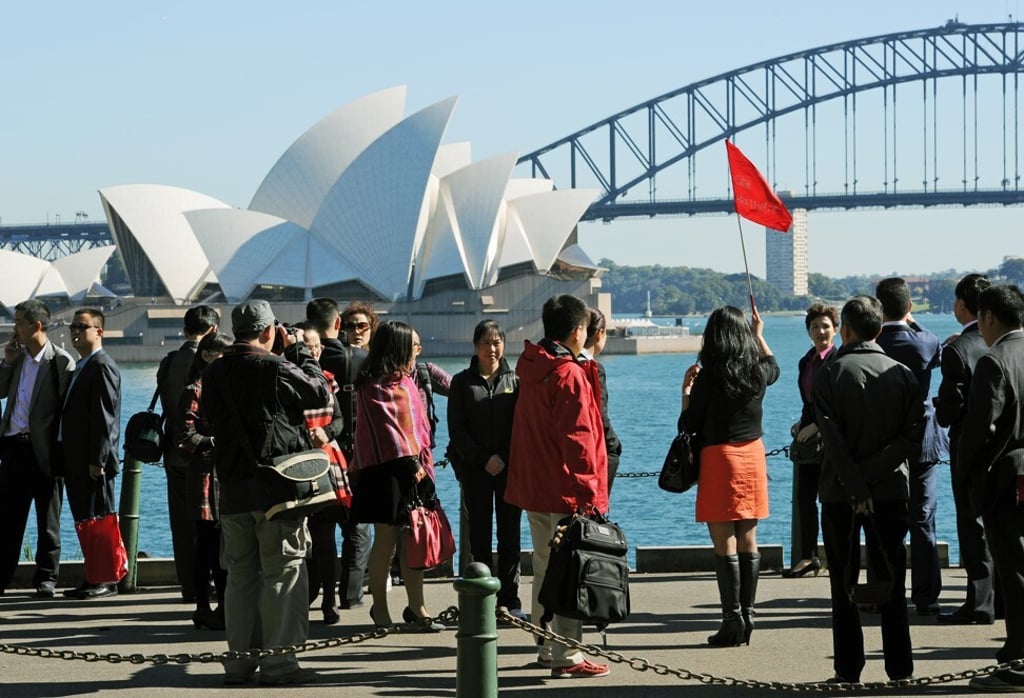 Chinese tourists enjoy views of the Sydney Opera House and Harbour Bridge. Photo: AFP Chinese tourists enjoy views of the Sydney Opera House and Harbour Bridge. Photo: AFP