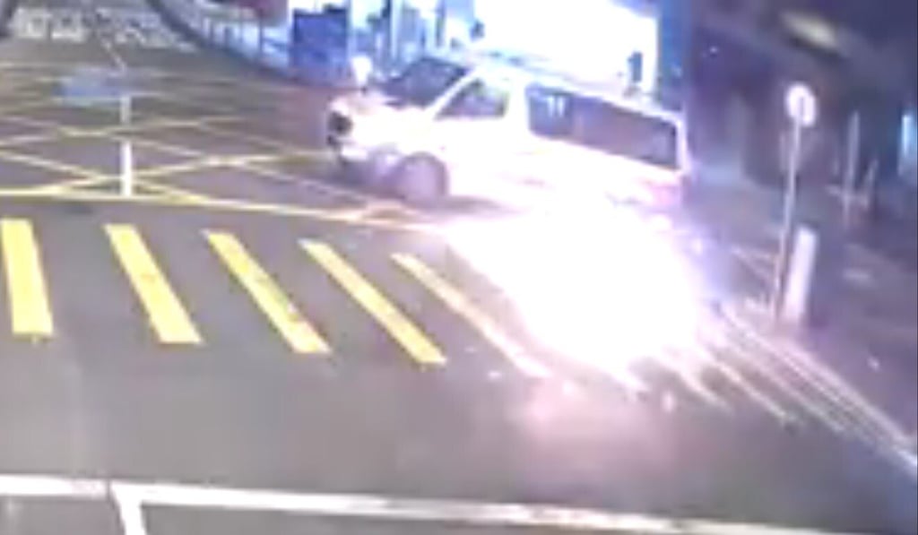A man standing next to a black Mercedes-Benz flung a petrol bomb at a police van opposite force headquarters. Photo: Facebook