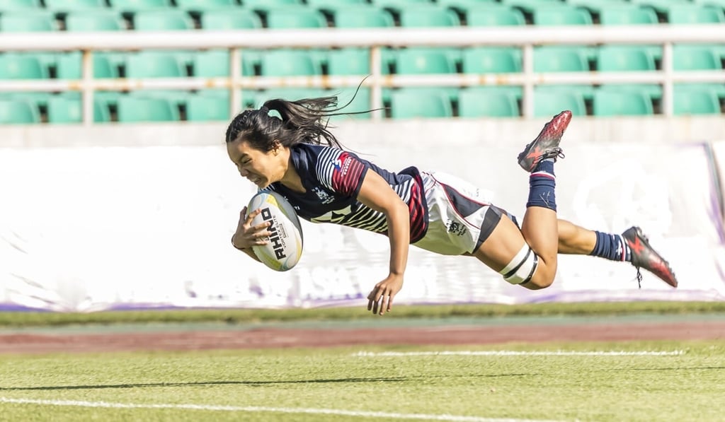 Anna Birkett dives in for her first try for Hong Kong. Photo: HKRU