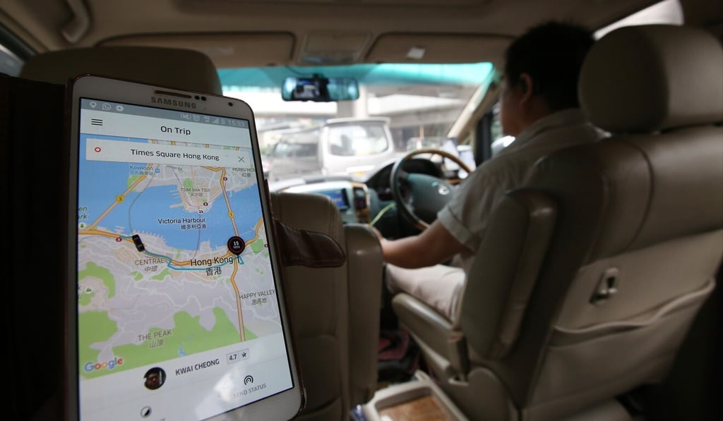 A Hong Kong passenger uses the Uber app in the city’s Wan Chai district. Photo: Edward Wong