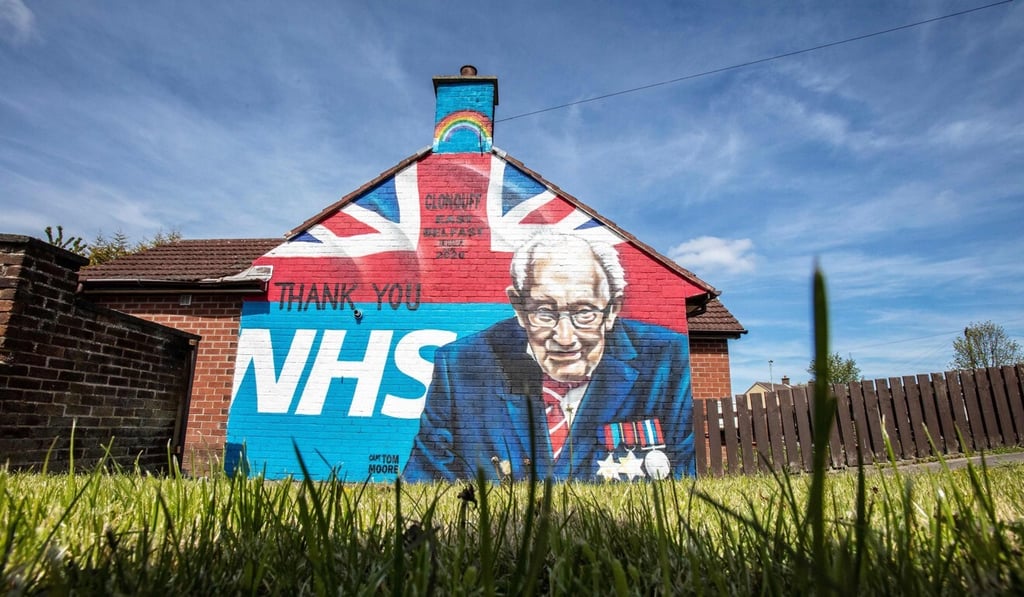 A mural, showing the logo of the NHS and an image 100-year-old veteran Captain Tom Moore. Photo: AFP