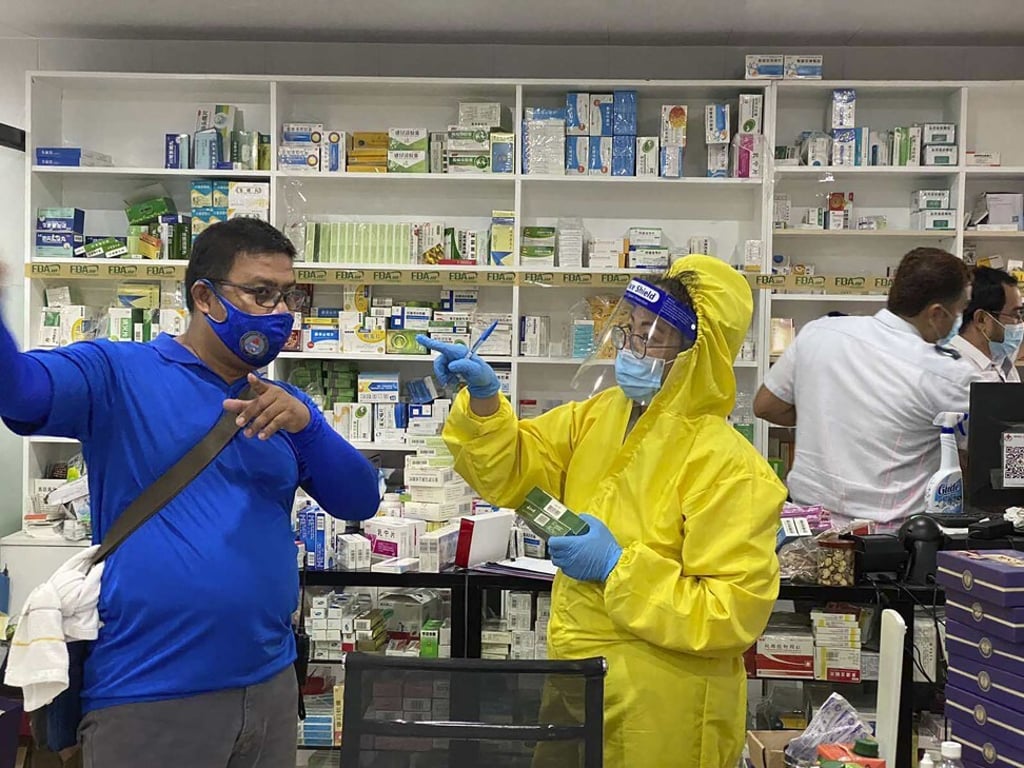 Police teams inspect a drug store beside a hospital during a raid on a villa which was illegally turned into a medical facility in Clark Freeport. Photo: AP