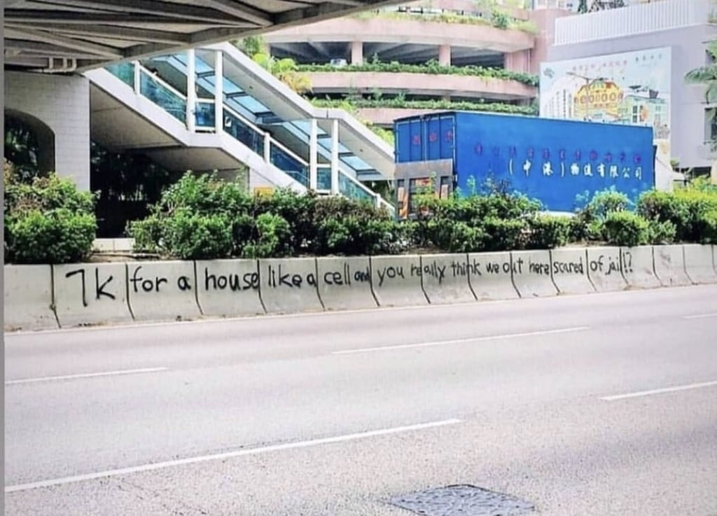 The lyric from a Txmiyama song spray painted on a road divider in Hong Kong during the 2019 protests.