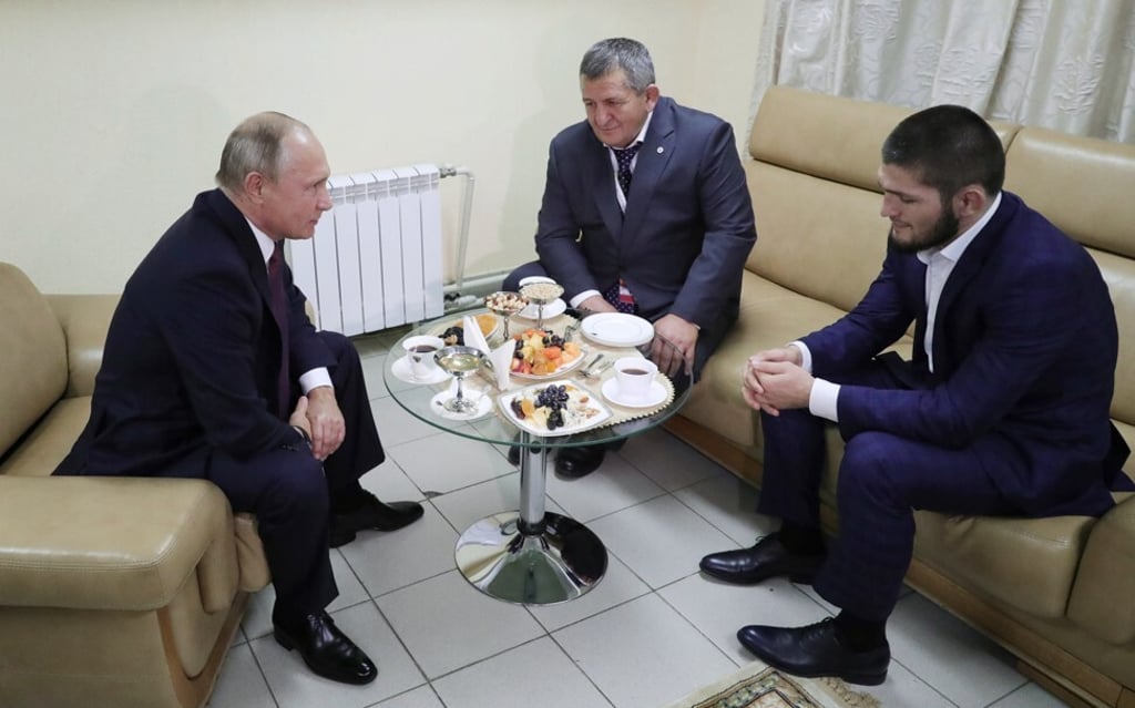 Russian President Vladimir Putin (left) speaks with Khabib Nurmagomedov (right) and his father Abdulmanap after the UFC lightweight champ defeated Conor McGregor. Photo: EPA Russian President Vladimir Putin (left) speaks with Khabib Nurmagomedov (right) and his father Abdulmanap after the UFC lightweight champ defeated Conor McGregor. Photo: EPA