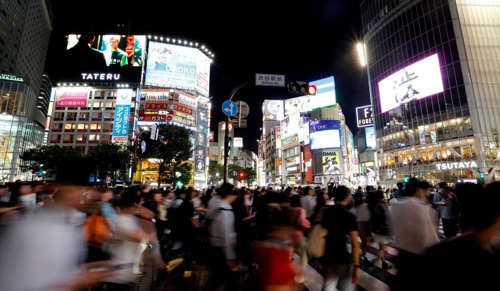 Pedestrians in the Shibuya shopping district of Tokyo, Japan. Photo: Reuters